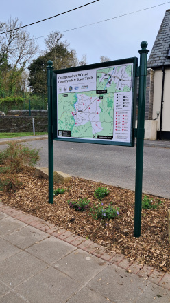 A rectangular trail board on a simple stand of two pillars.