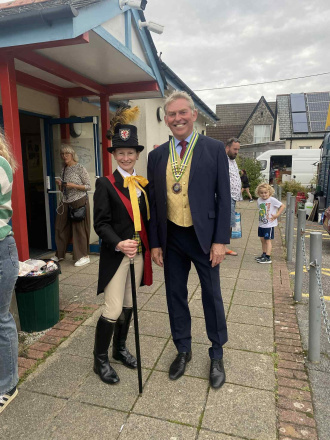 Town cryer and chair of parish council attending carnival.